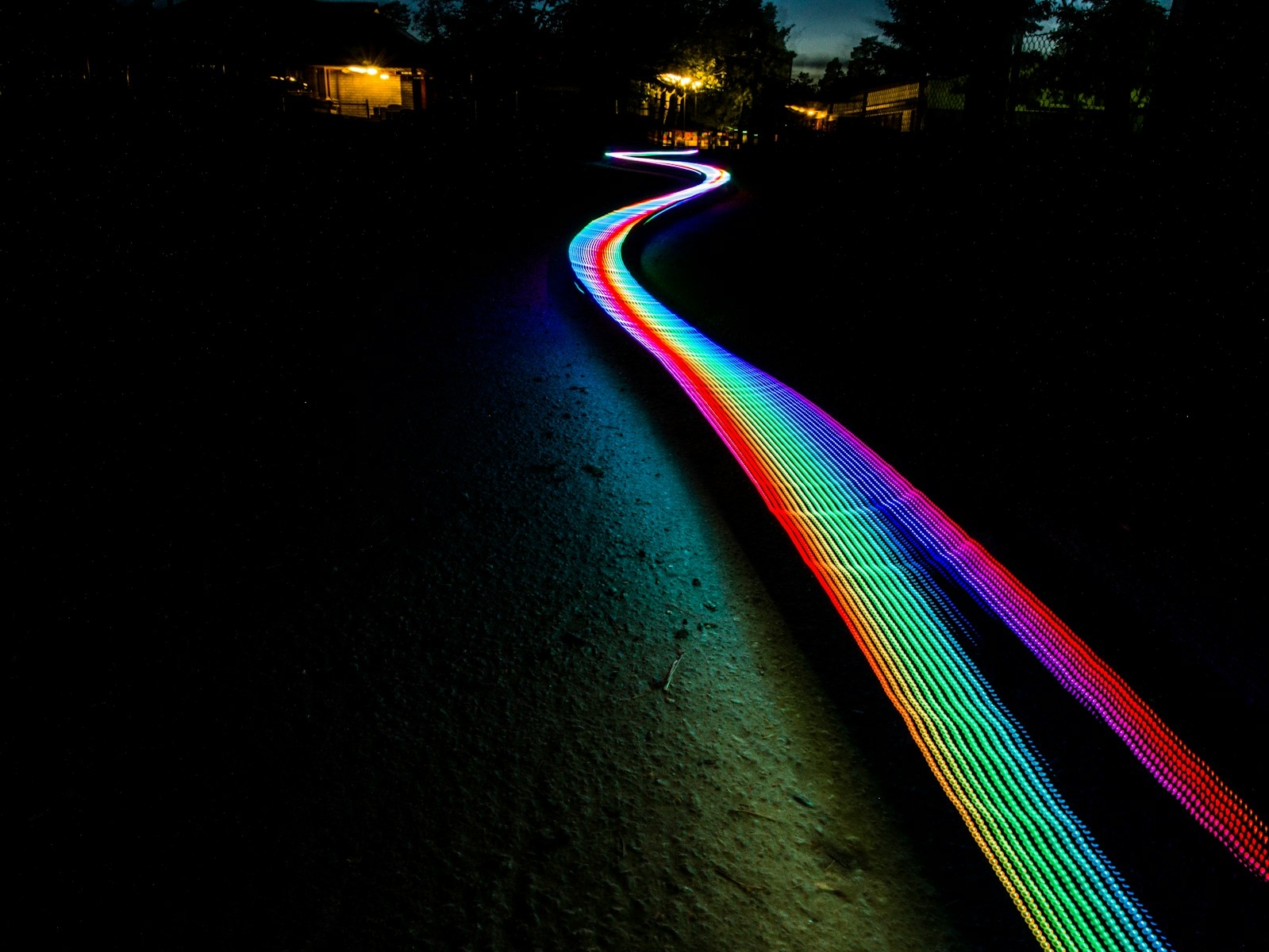 multicolored light passage in dark area